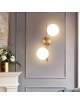 Applique da parete metallo oro con 2 sfere in vetro bianco attacco G9 lampada design moderno minimal