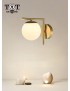 Applique da parete metallo oro con sfera in vetro bianco attacco G9 lampada design moderno minimal